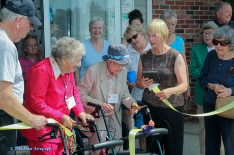 Lucille Machon and Trudie Seybold, both 98 cut the ribbon