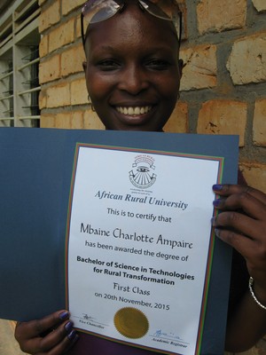 ARU Graduate Charlotte Mbaine Ampaire holding her Degree